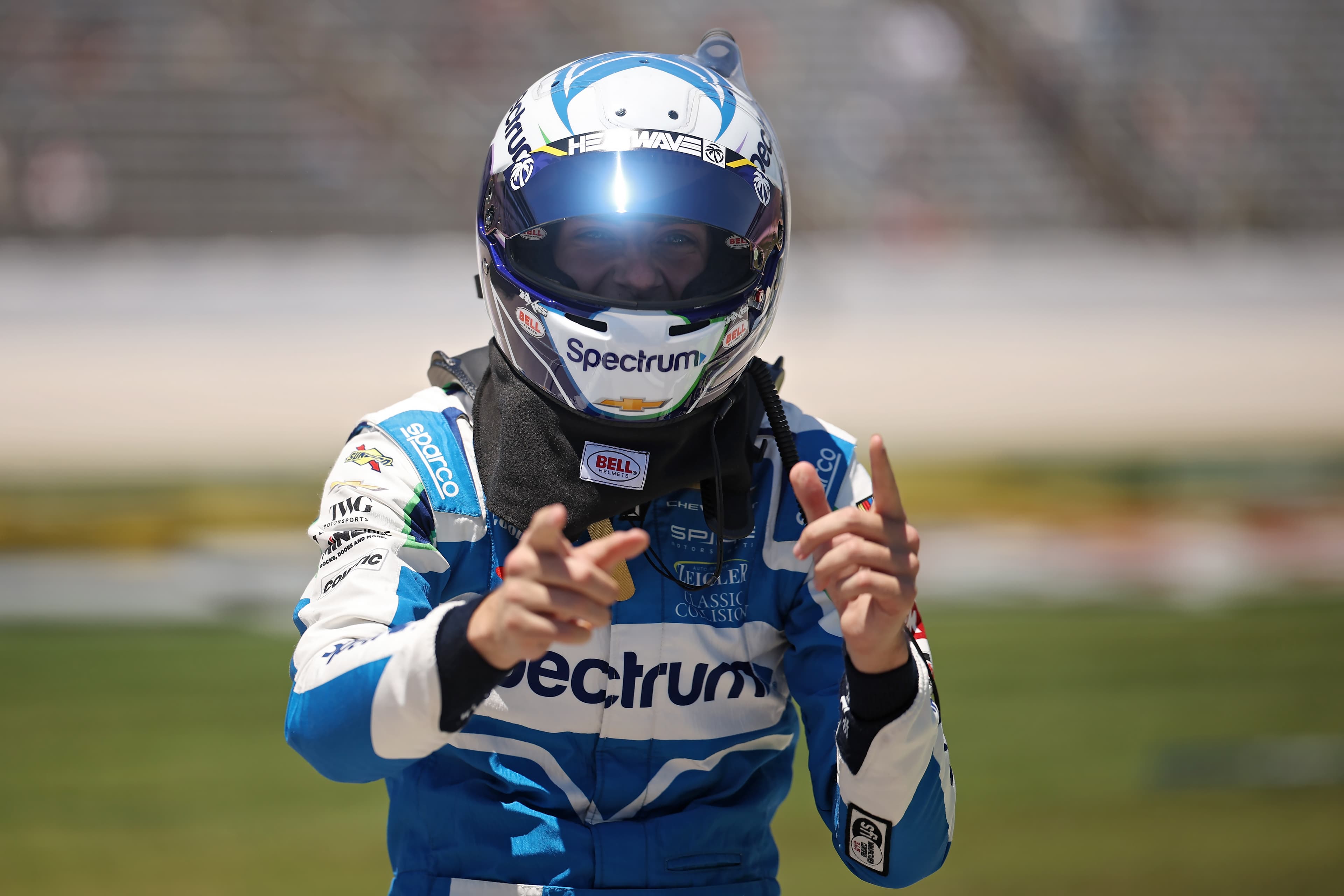 Carson Hocevar, driver of the #77 Spectrum Chevrolet, celebrates after winning the pole position during qualifying for the NASCAR Cup Series Würth 400 presented by LIQUI MOLY at Texas Motor Speedway on May 2, 2026 in Fort Worth, Texas. (Photo: James Gilbert/Getty Images)