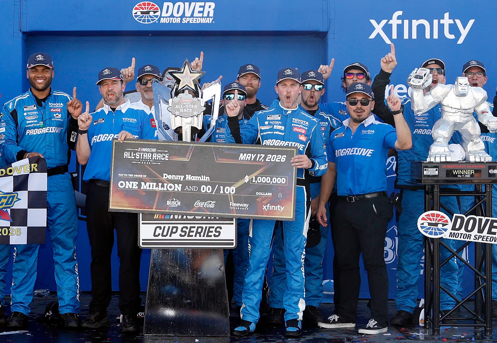 Denny Hamlin poses with the one million dollar check in victory lane at Dover Motor Speedway after winning the NASCAR All-Star Race